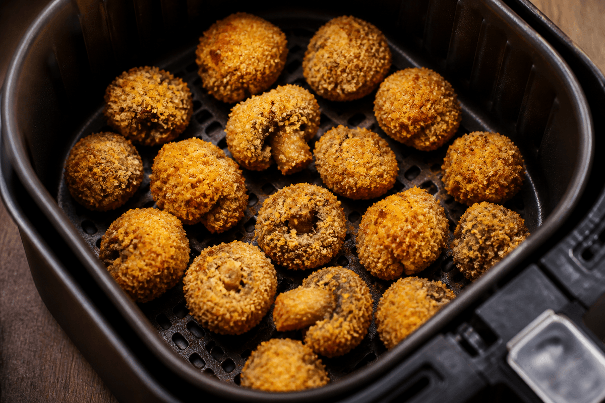 Crumbed mushrooms in the air fryer basket