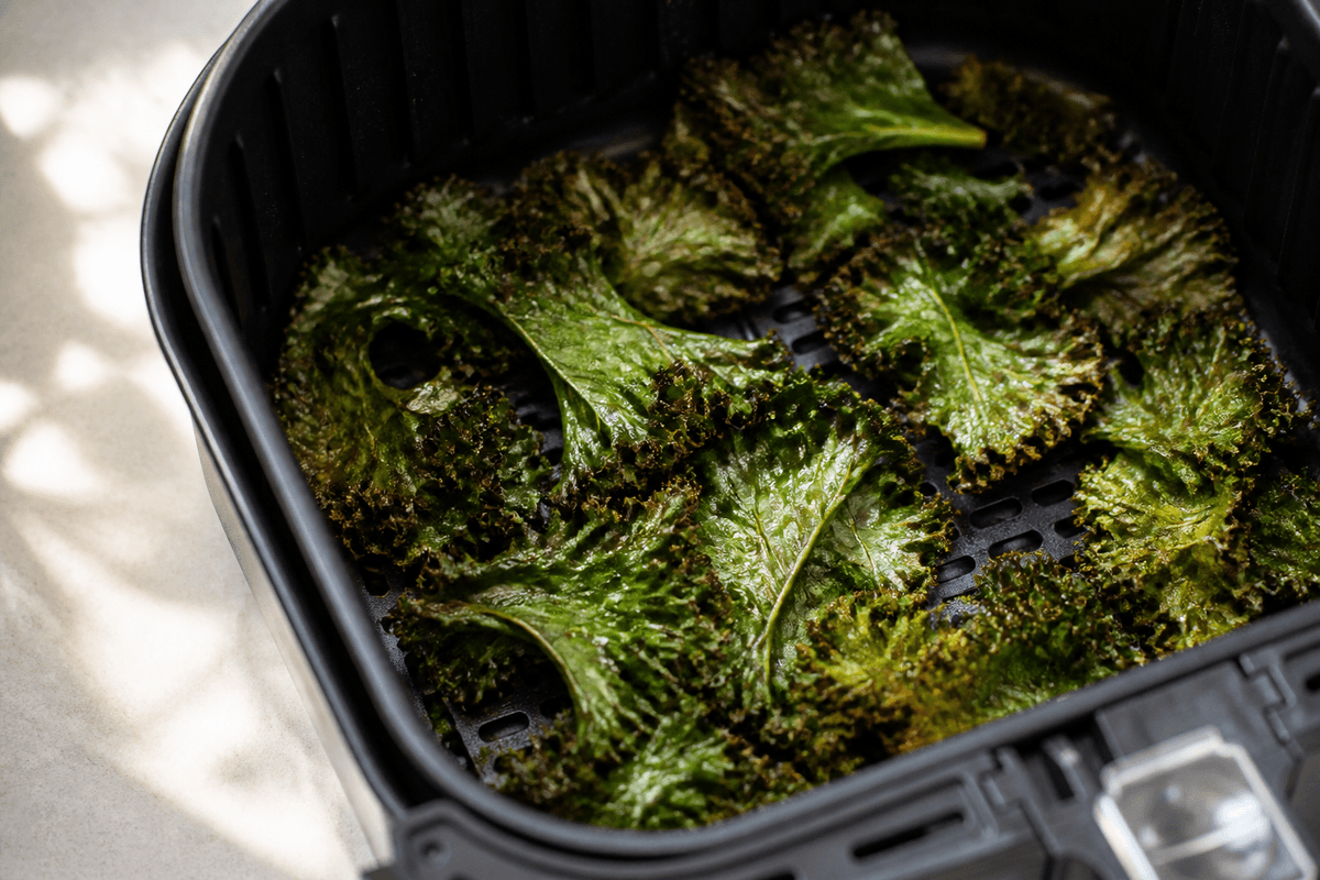 Kale crisping in the air fryer basket