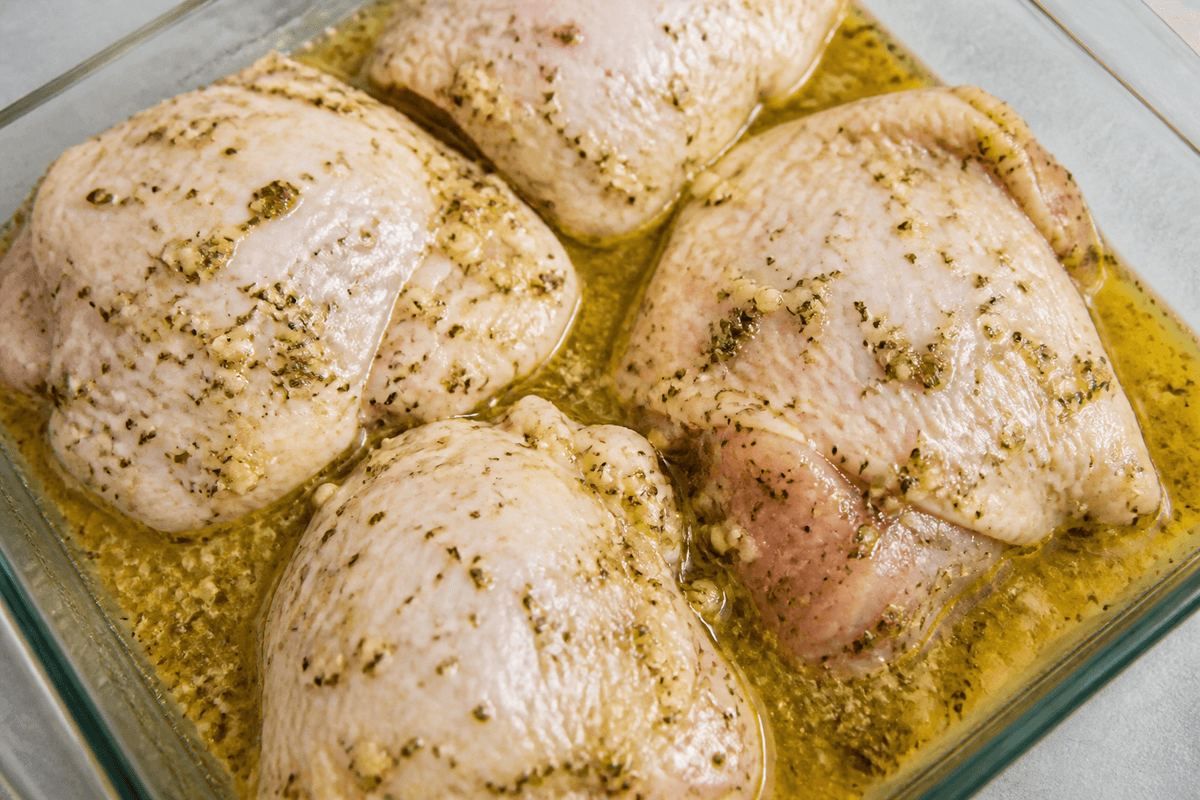 Chicken thighs coated in lemon oregano marinade