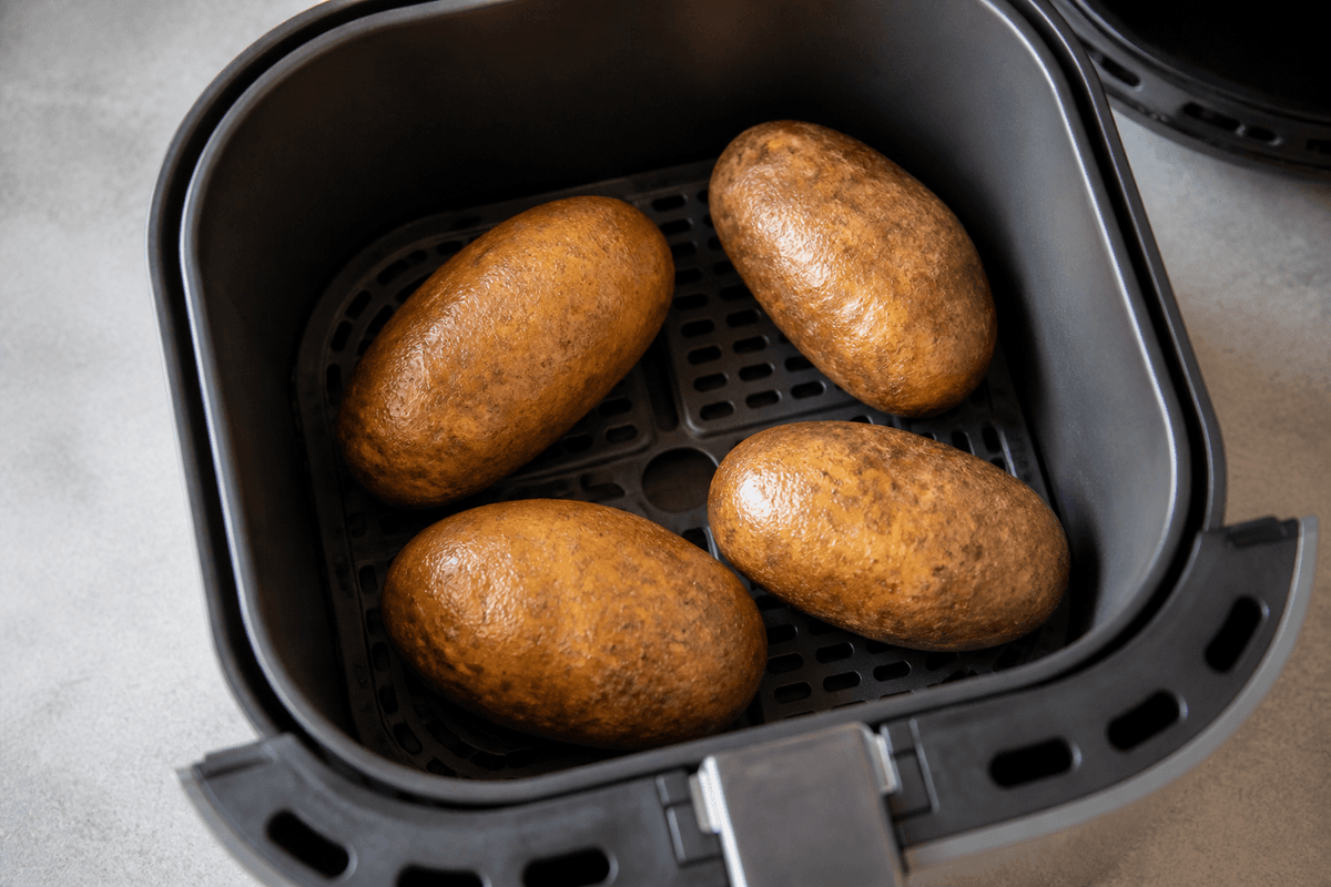 Baked potatoes cooking in the air fryer