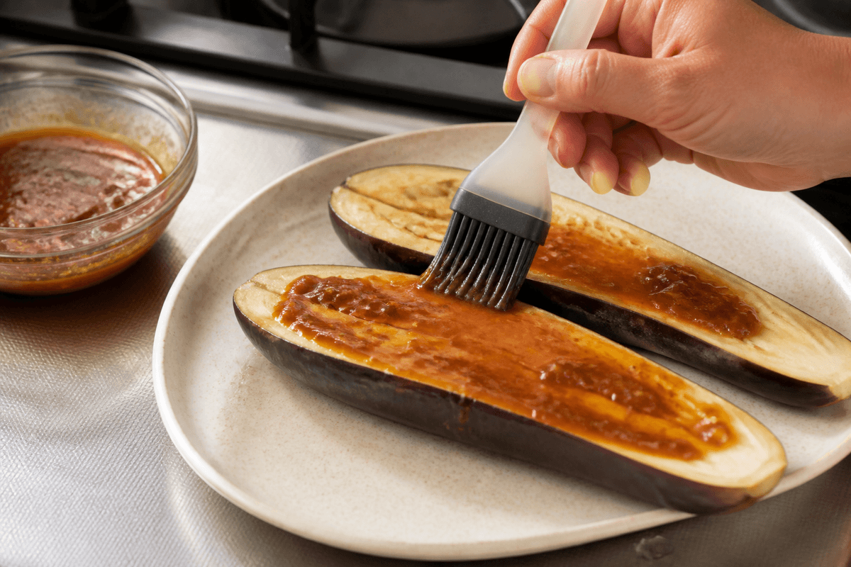 Miso glaze brushed onto cooked eggplant