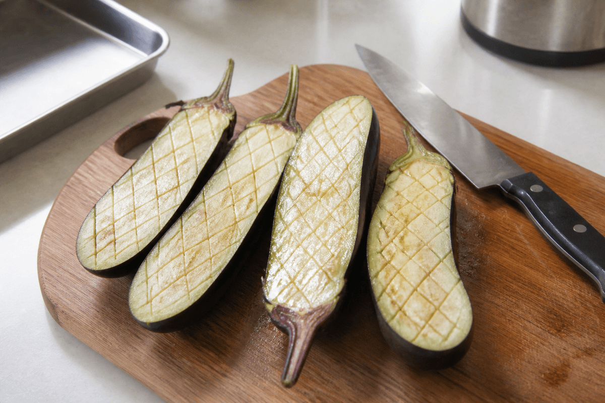 Eggplant halves scored in a diamond pattern