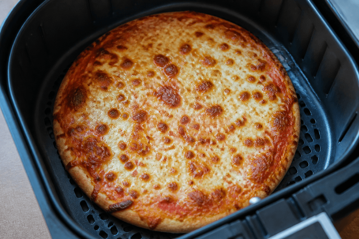 Blistered air fryer pizza with melted cheese
