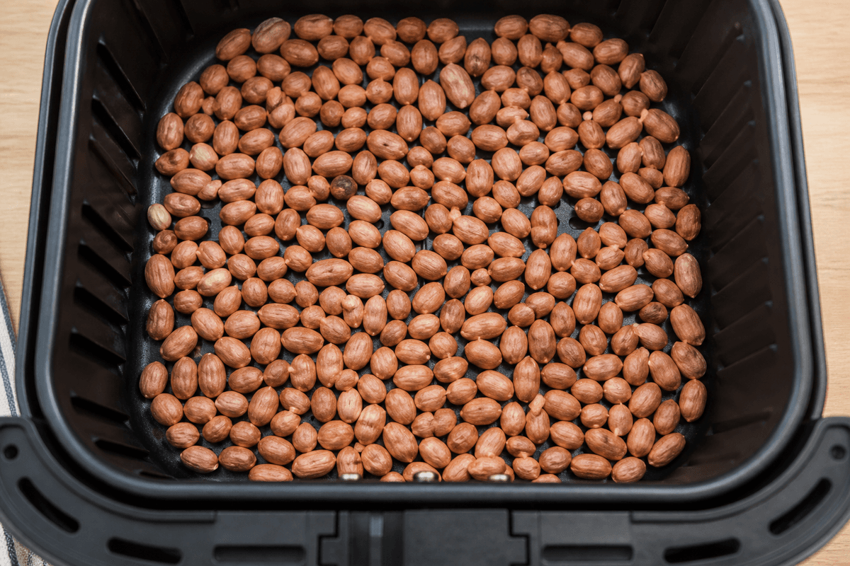 Honey-glazed nuts roasting in the air fryer basket