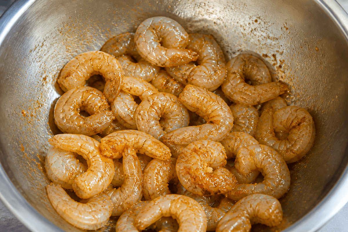 Shrimp tossed with oil and spices before air frying